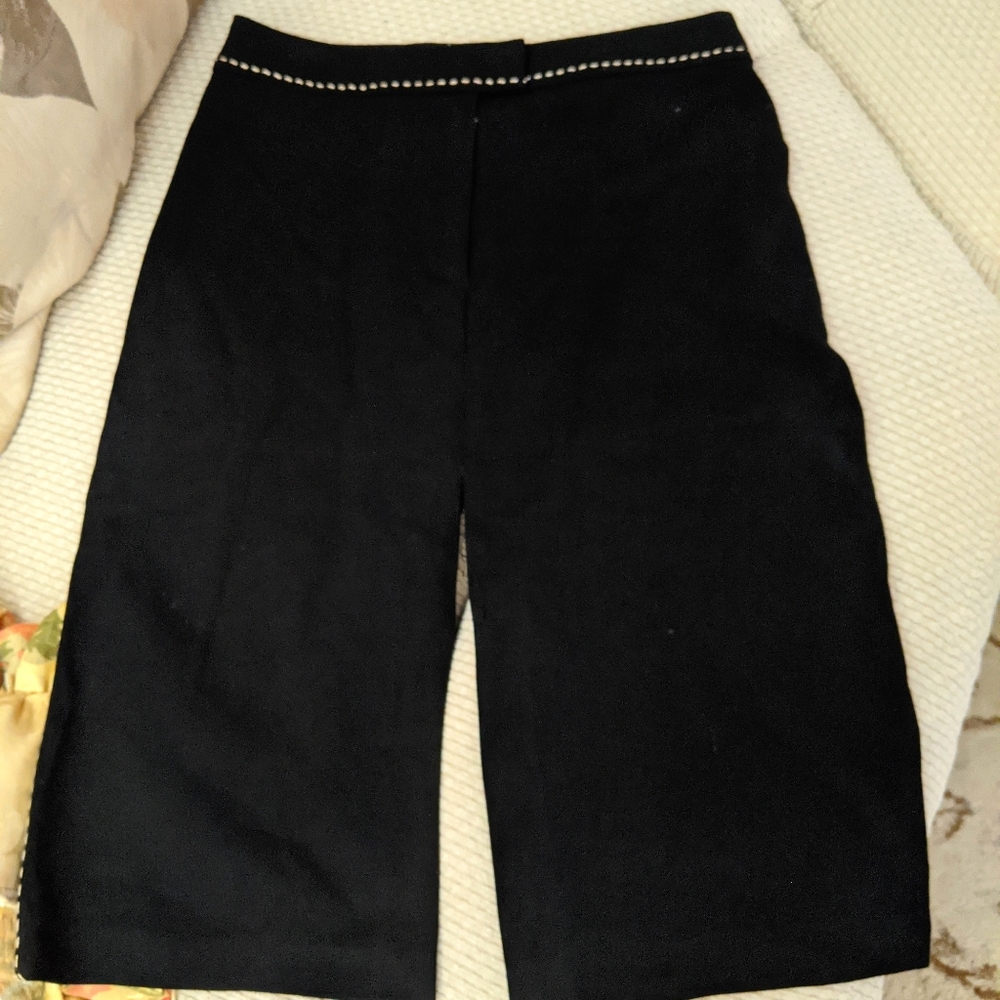 Elegant black midi skirt with front and back slits